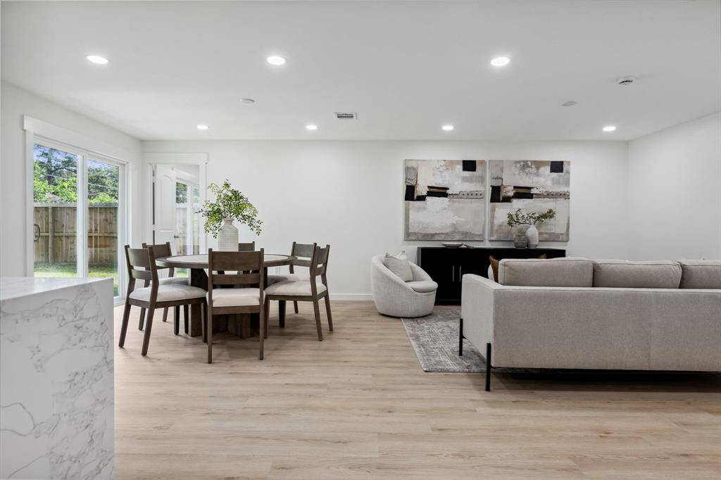 Open-concept layout with effortless indoor-outdoor flow through sliding glass doors.