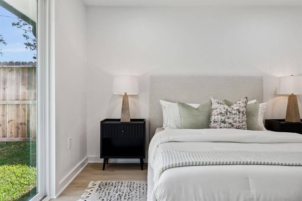 Peaceful retreat with sliding door access to the yard and soft neutral tones.