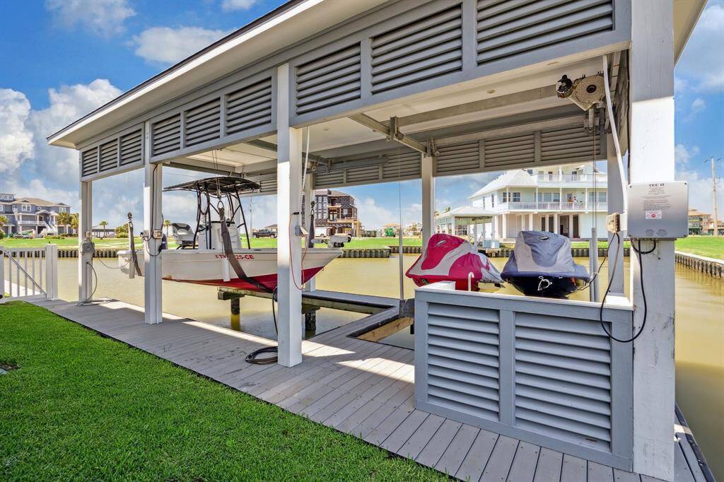 40' boathouse with boat lift, double jet ski lift, fish cleaning station, swim ladder & continued Trex decking. Boathouse can be extended if needed