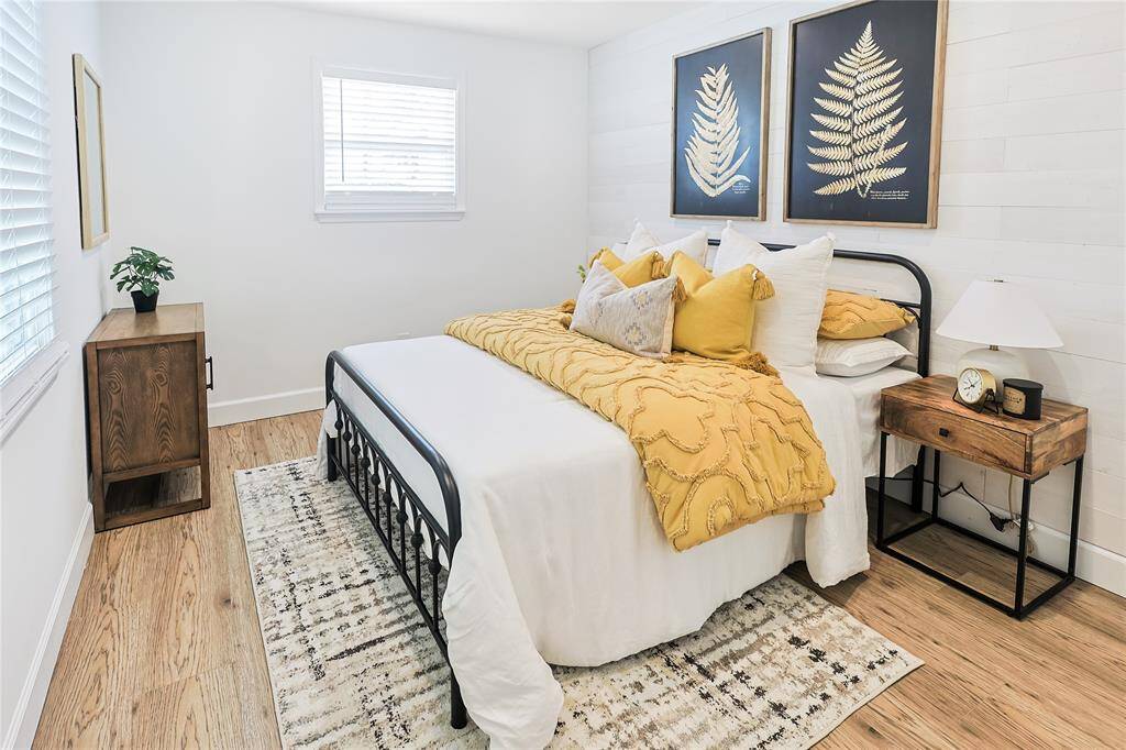 Beautiful shiplap-style wall in this bedroom gives a modern touch of flare and style.