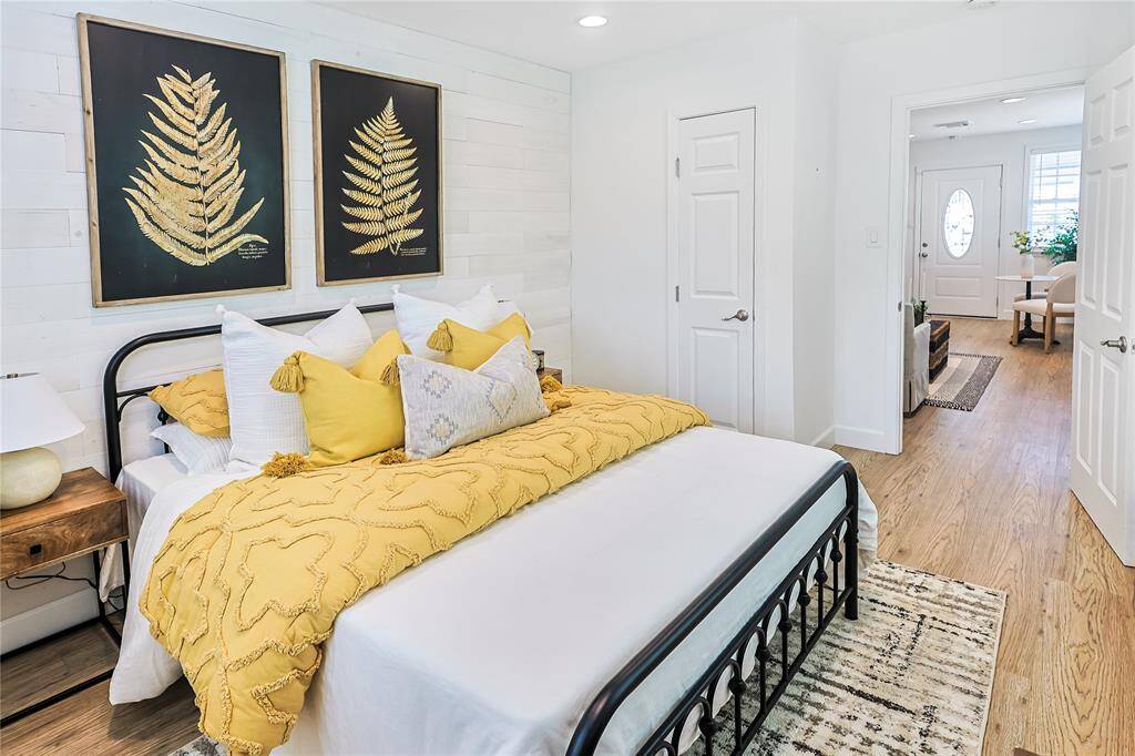 The shiplap accent wall adds charm and character to this room!