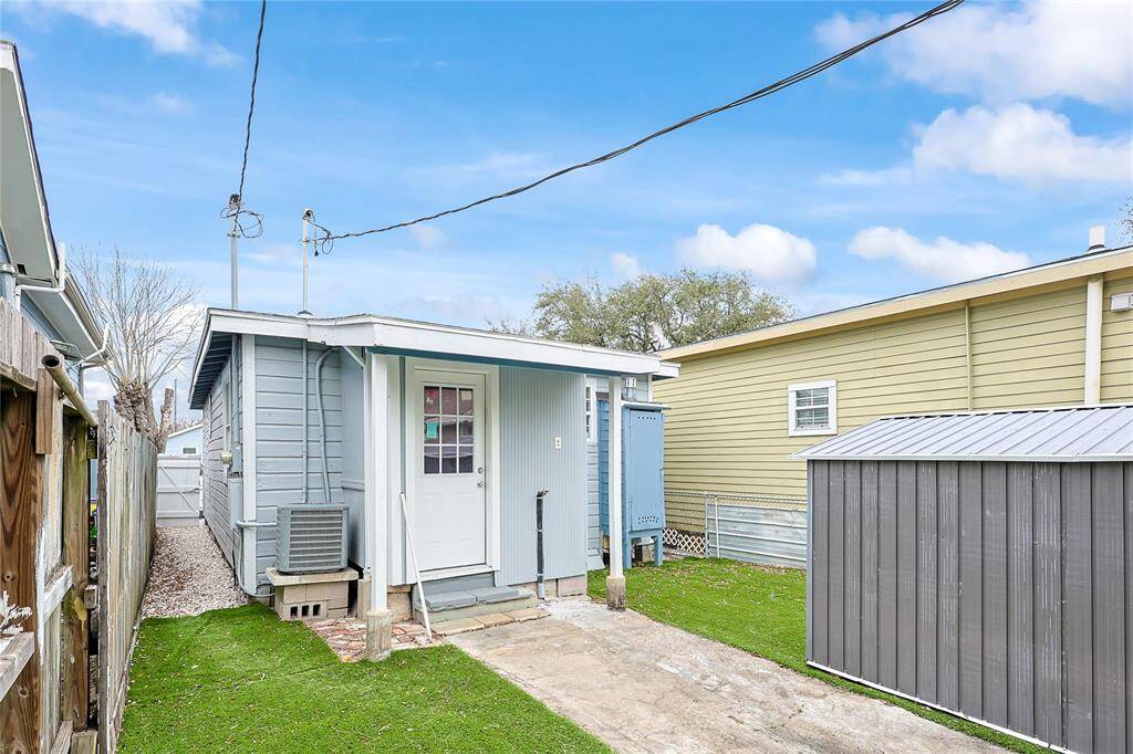 Low-maintenance yard between the separate homes of this multi-family property.