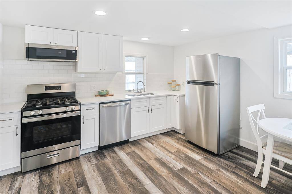 Enjoy the beautifully updated kitchen complete with stainless steel appliances including dishwasher.