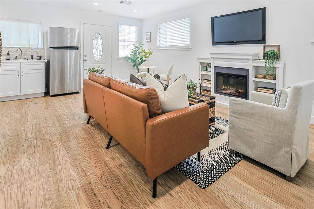 Enjoy cozy nights by the fireplace or entertain guests in this open-concept home.
