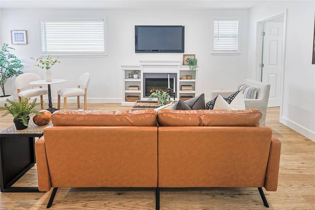 Cozy spacious living area with a fireplace to warm up the room.