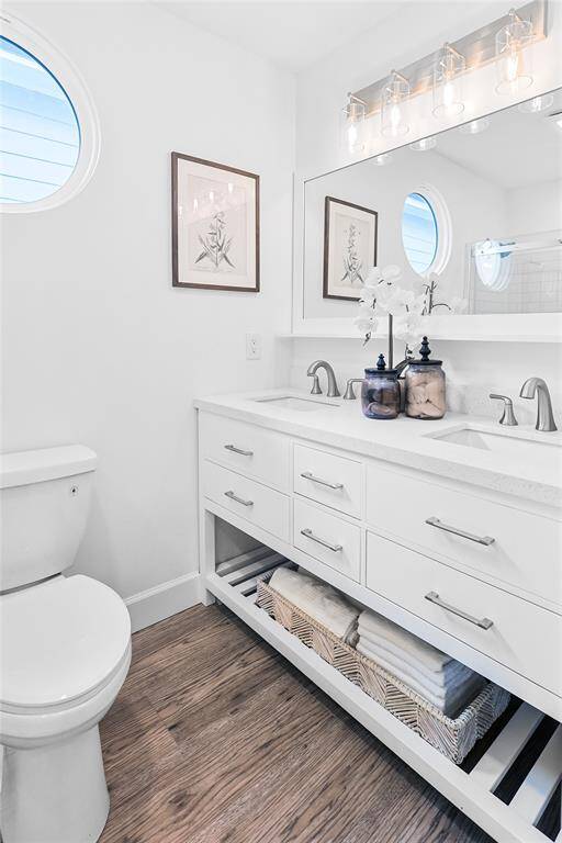 Beautiful light fixtures complement the modern look of this bathroom