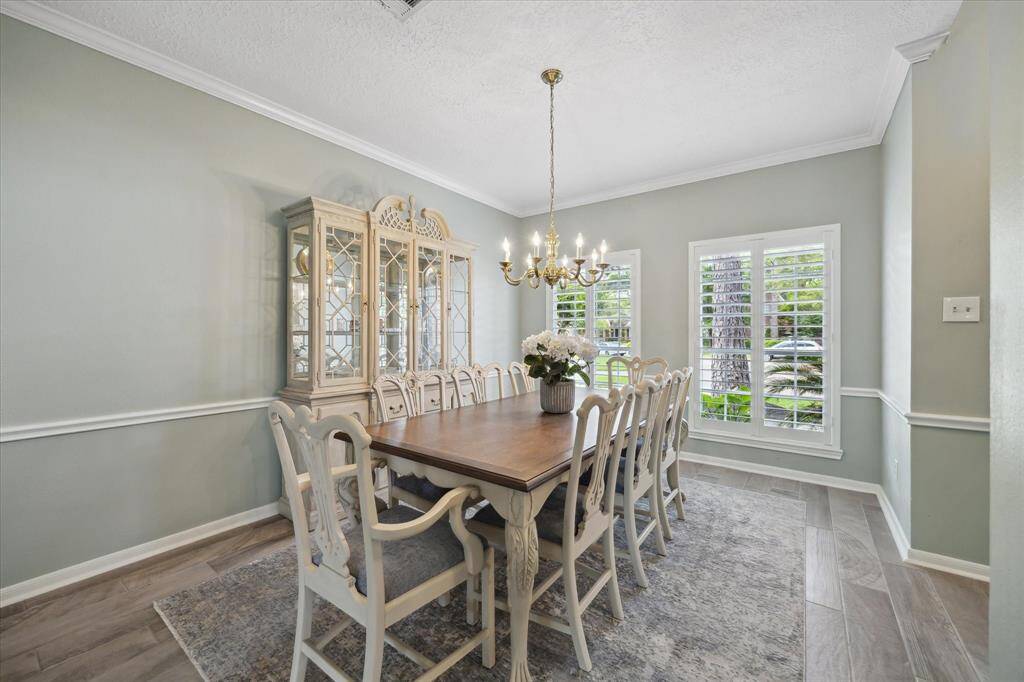 The formal dining room offers flexibility to suit your lifestyle—easily transformed into a conversation lounge or stylish sitting room for hosting guests or enjoying a quiet moment with a good book.
