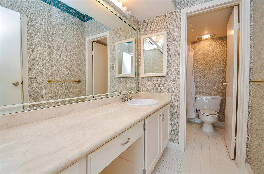 The bath had double sinks, a long vanity, tub/shower and walk-in closet.