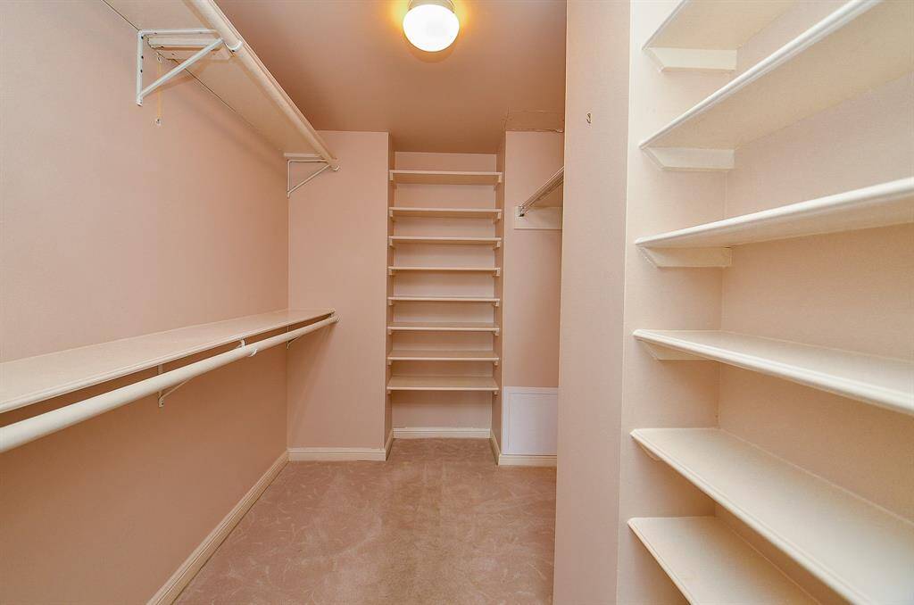 The walk-in closet is spacious.