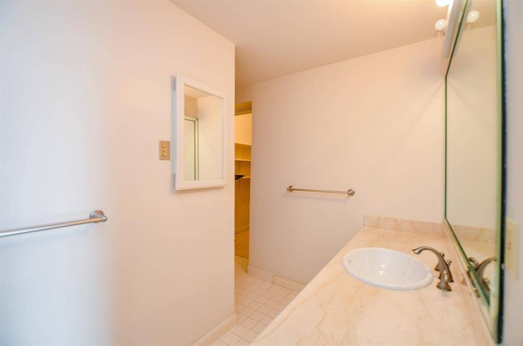 The secondary bedroom has an en-suite bath with a tub/ shower.
