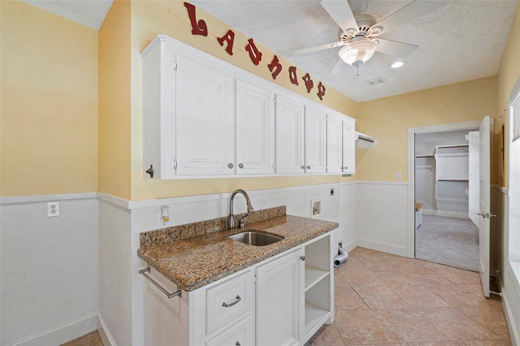 Just off the entry is this MUD/Laundry room that is attached to the primary closet, making the task of cleaning up after a day exploring the property easy peasy!