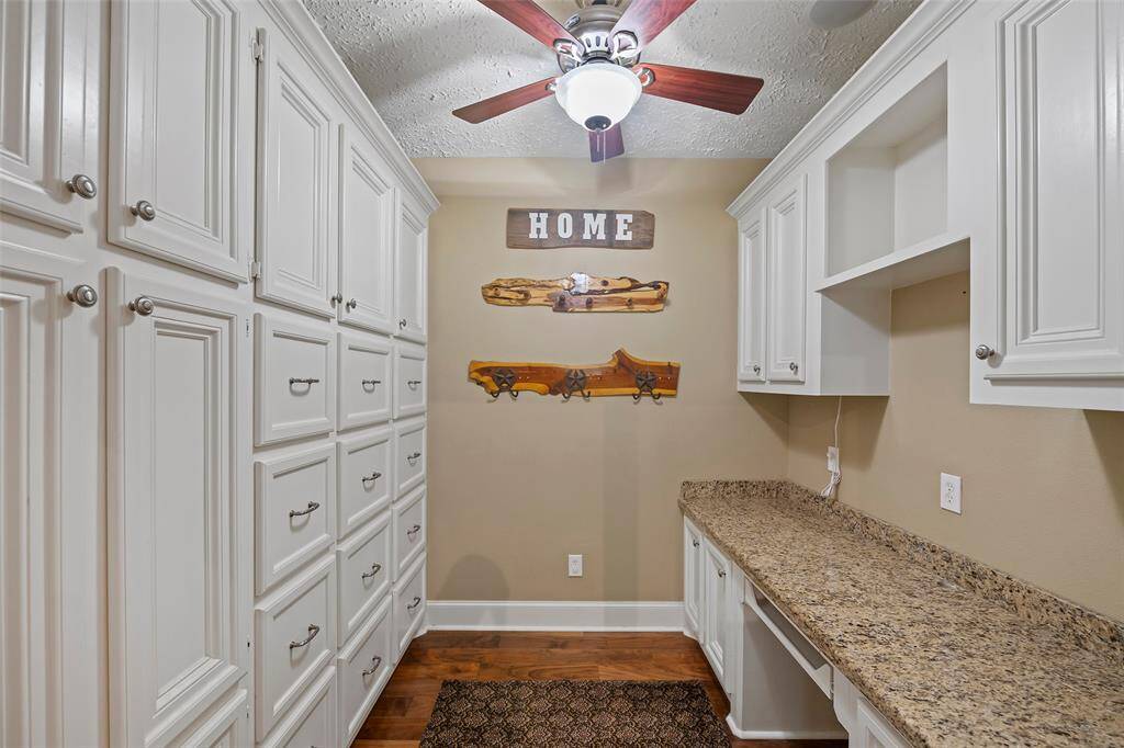 This charming space provides so much storage!  It would make the ideal study, wrapping room, or just a place to sit and pay bills!