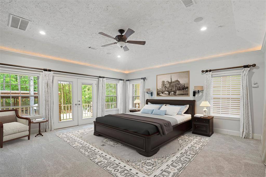 A serene primary suite is the perfect spot for a quick nap or peaceful slumber! Crown molding with uplighting creates the ideal ambience for either!
