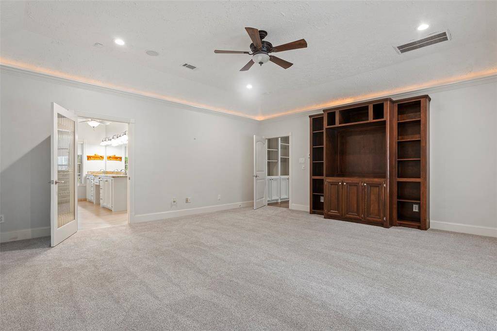 Custom built-ins and neutral paint along with soft carpet under foot completes the space!