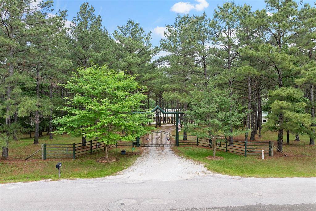 This home is tucked behind privacy gates with a grand drive that is a showstopper!