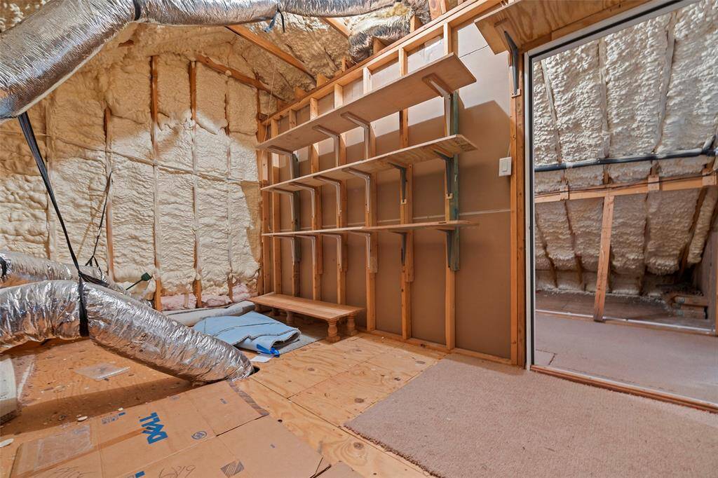 An awesome floored attic space with shelving provides a spot for additional storage of those holiday decorations or cherished keep-sakes!