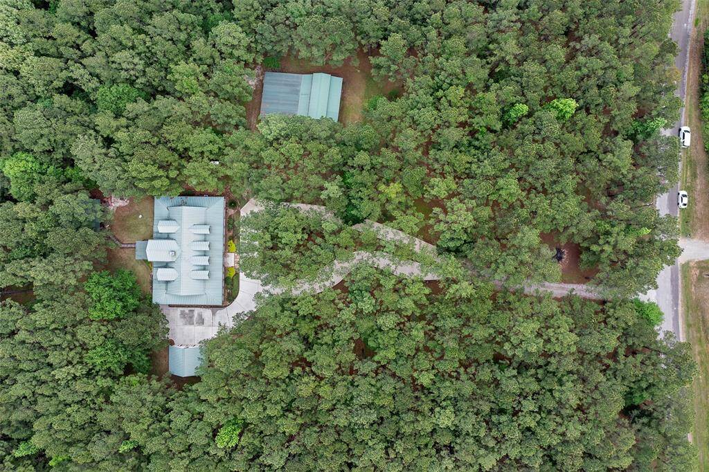 This aerial view shows you where this home sits and the immediate treed spaces that surround it creating a private treasure just for you and yours!