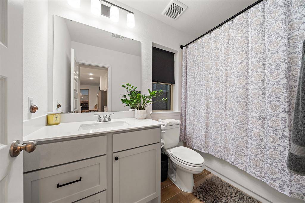 Secondary bathroom features atub/shower combo and vanitywith plenty of counter space.