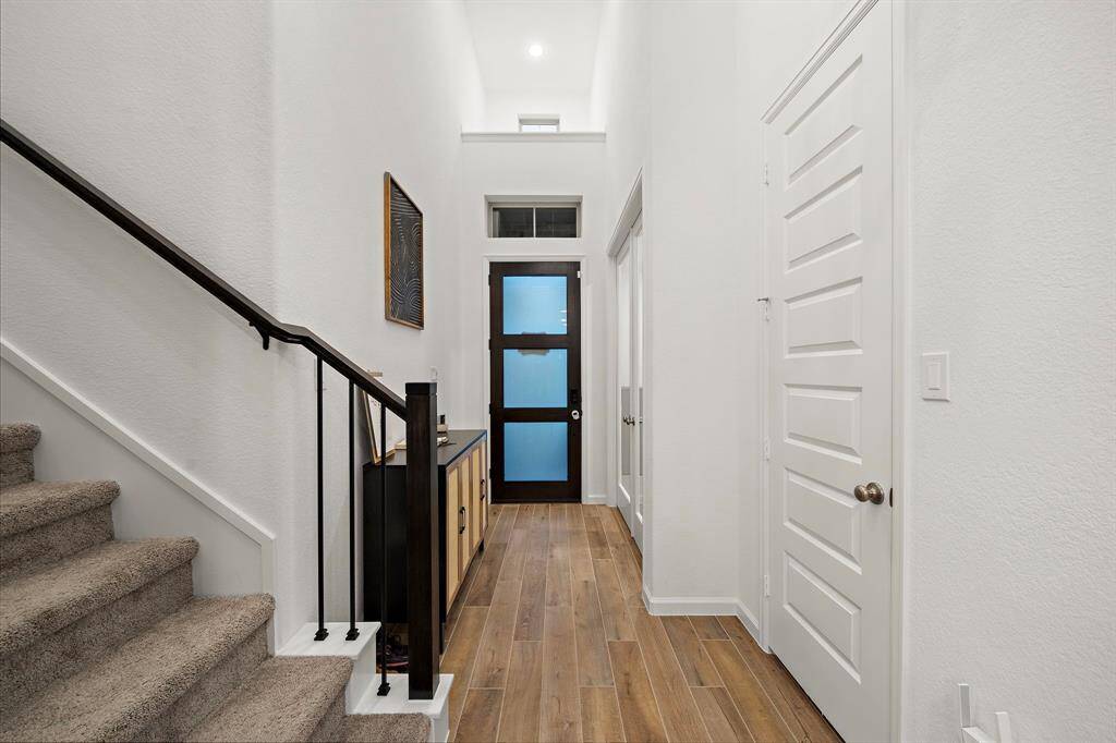 The elongated foyer boasts highceilings.