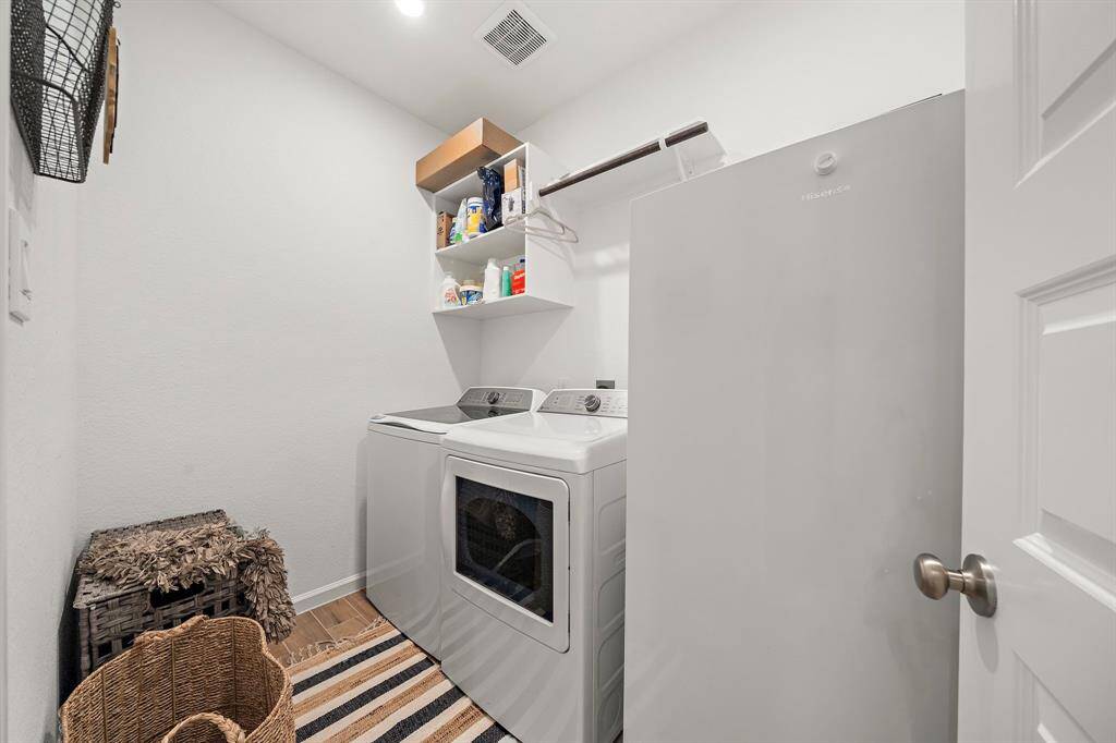 The laundry room features washer and dryer connections, andplenty of storage space.