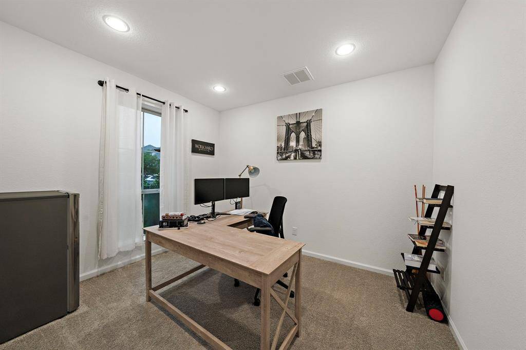 Transform your work routine into ahaven of productivity and comfort inthis thoughtfully designed homeoffice/library. Located behind private Frenchdoors, the room features plushcarpet and window that allows innatural light.