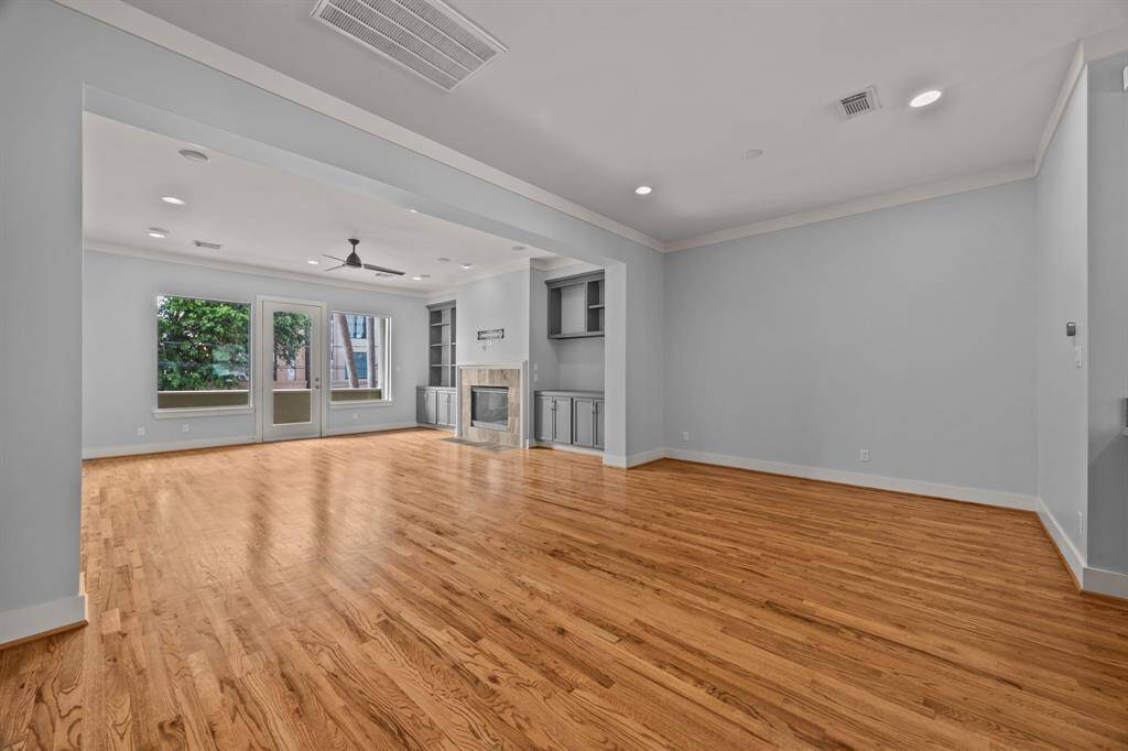 Gorgeous living room with soaring ceilings and hardwood floors