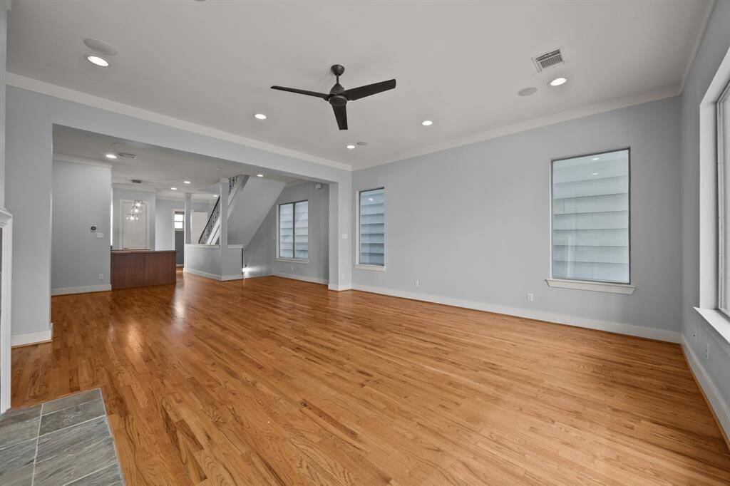 Soaring ceilings while looking toward the front patio from the kitchen
