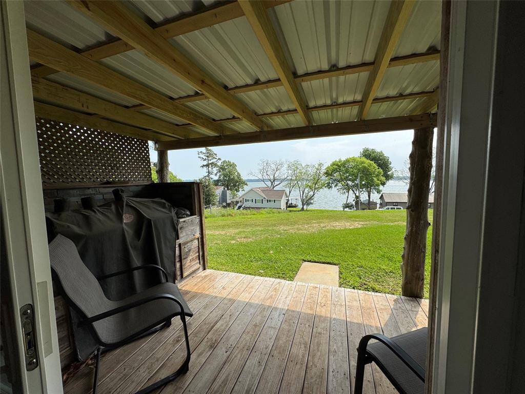 Private covered patio with it's own area for grilling and watching the activity on the lake.