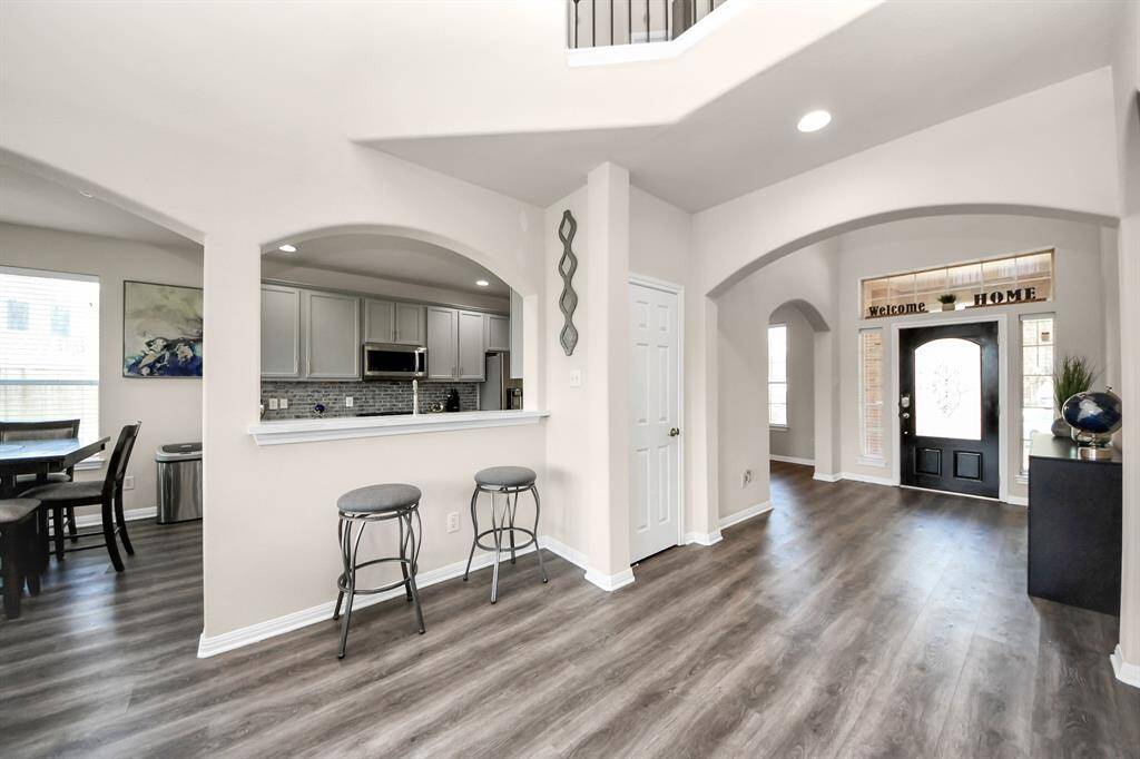 Pull up a few bar stools and enjoy conversations by the kitchen.