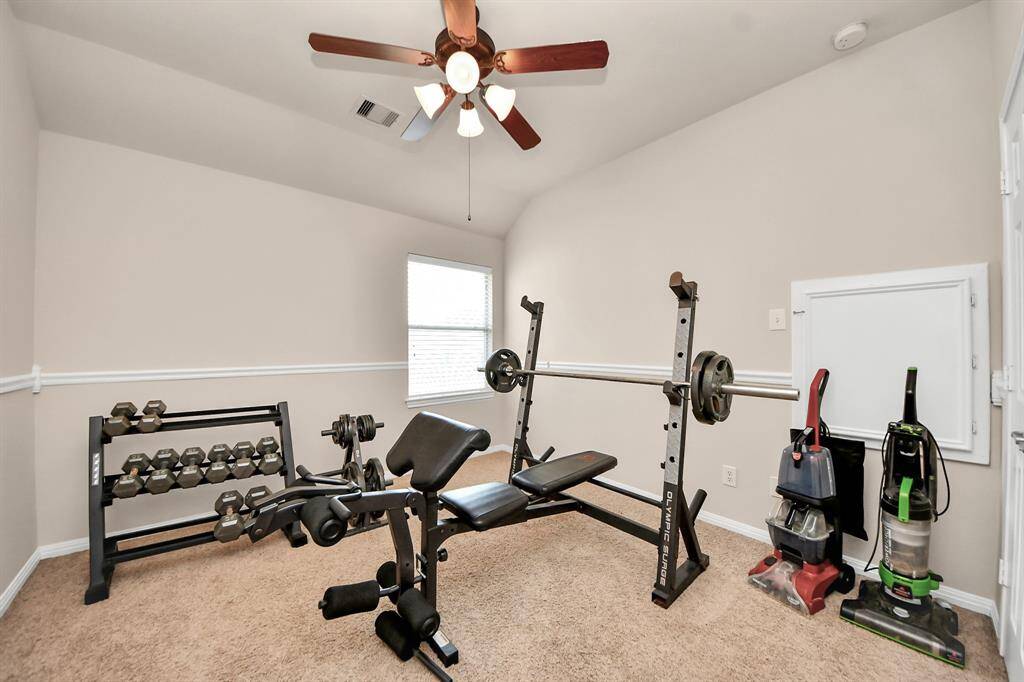 Secondary bedroom #1 is being used as a workout room.