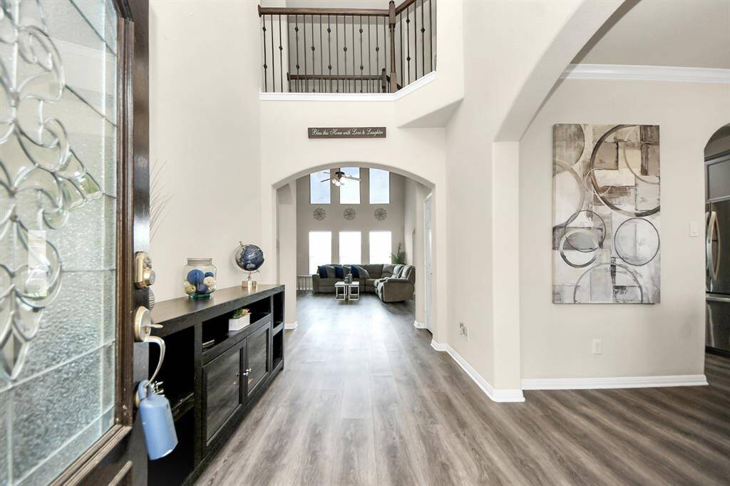 As you enter the home, you will notice the high ceilings and natural light flowing into the open space.