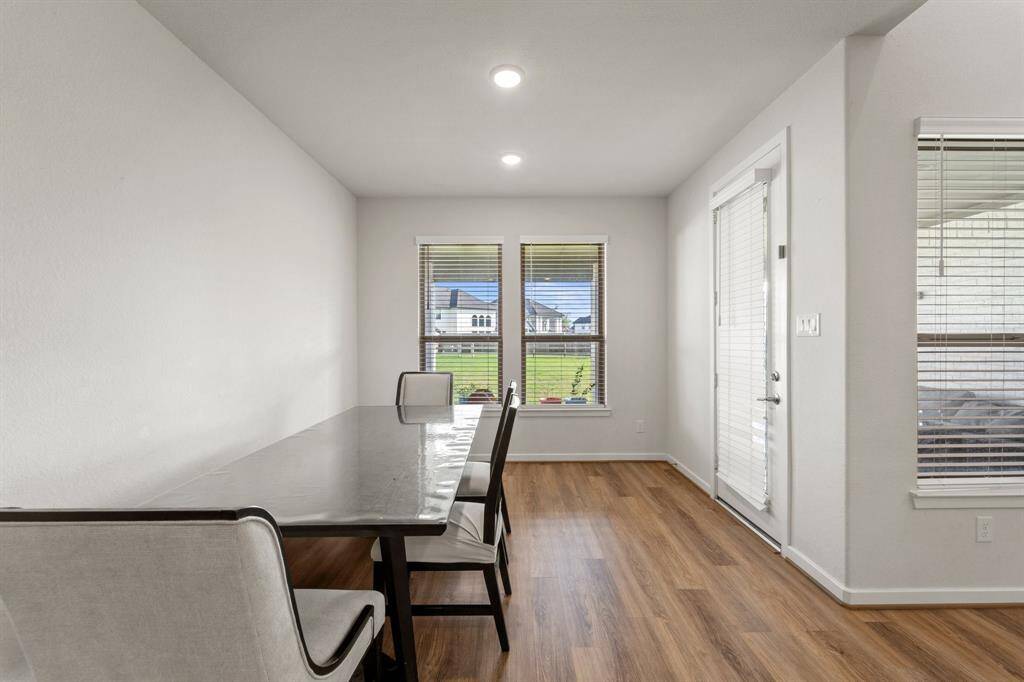 The breakfast nook overlooks the backyard and offers a peaceful dining space with direct access to the covered patio.