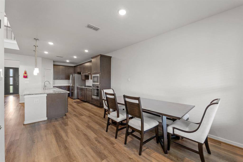 This light-filled dining space connects directly to the kitchen, making mealtime and hosting effortless.
