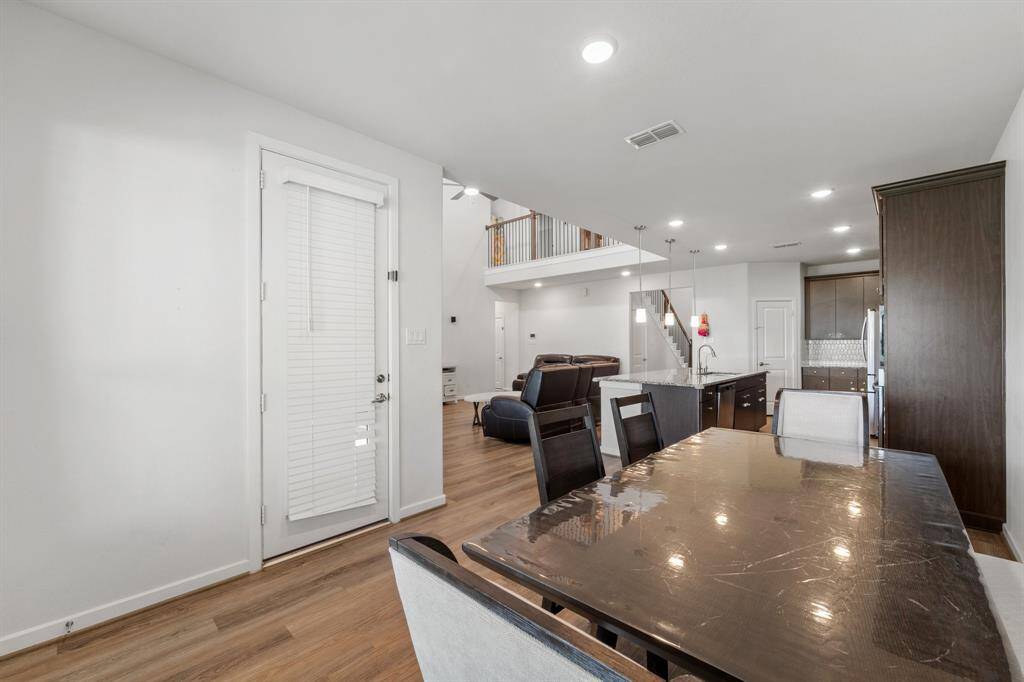 Enjoy open sight lines from the breakfast nook to the living room and kitchen, blending dining and gathering spaces beautifully.