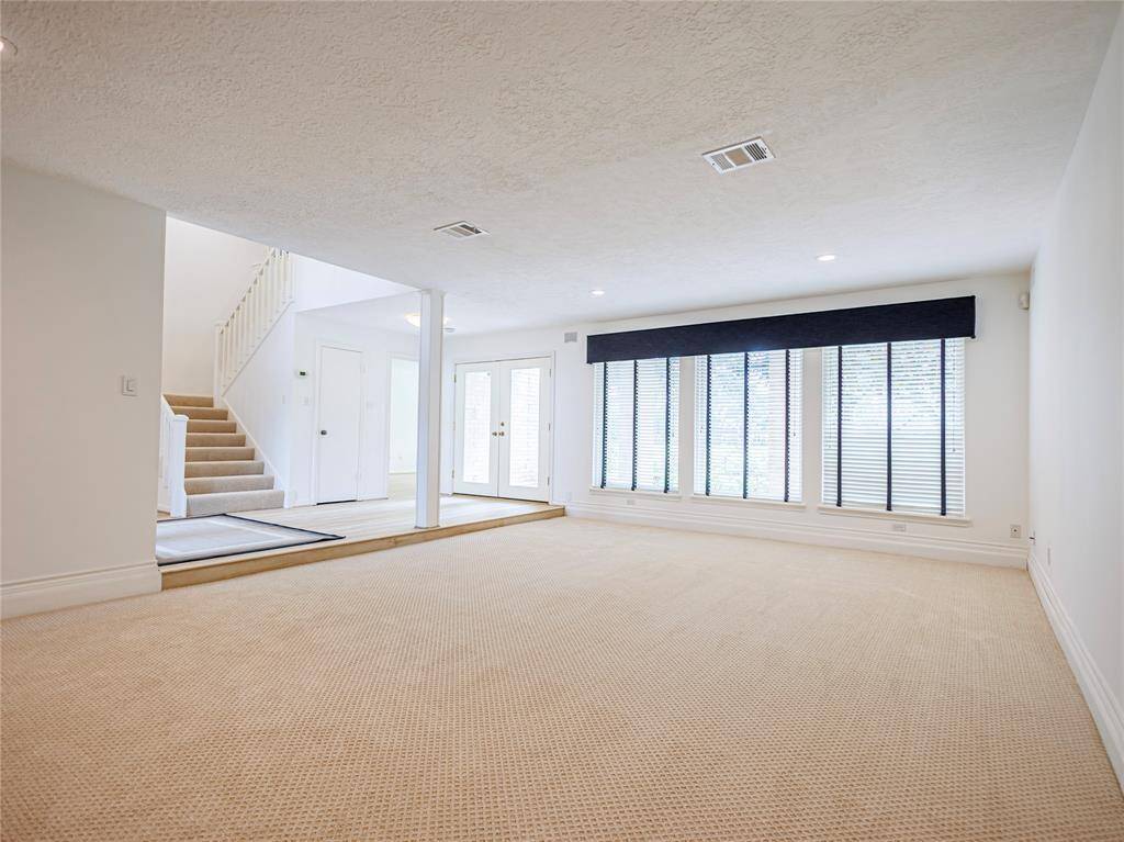 Large den with new carpets.