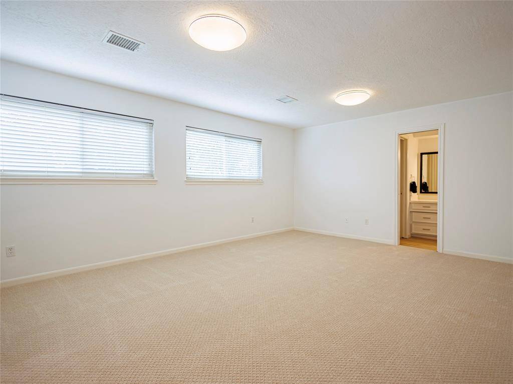 Large game room upstairs with new carpets.