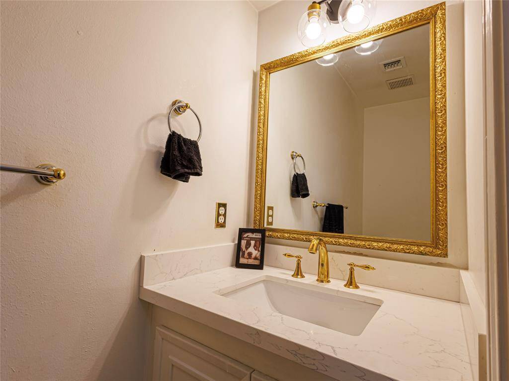Half bath near the laundry room and kitchen.