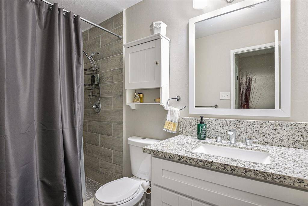 Primary bathroom with granite countertops