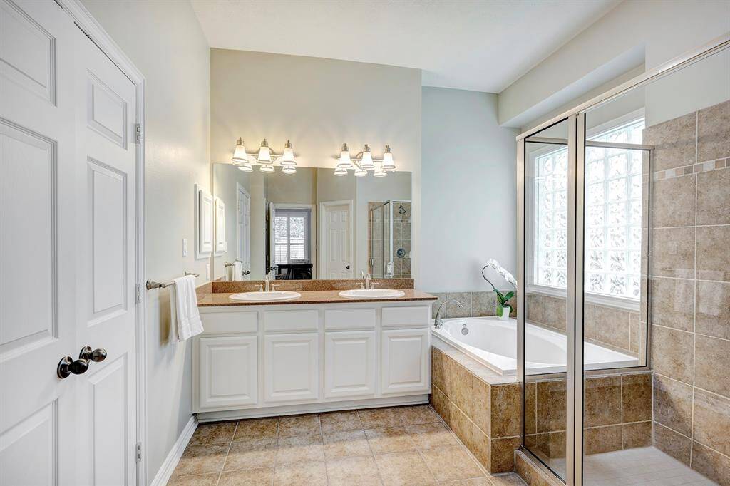 Primary bath on first floor with large walk-in closet to the left