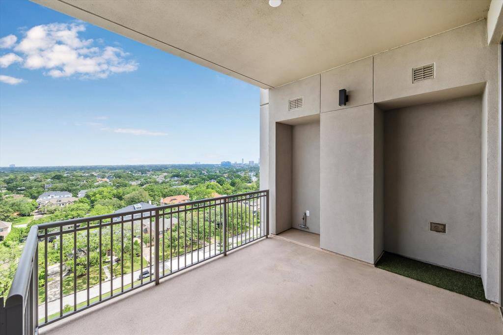 Spacious primary bedroom with seating area, floor to ceiling windows and spectacular North views. Photo is virtually staged