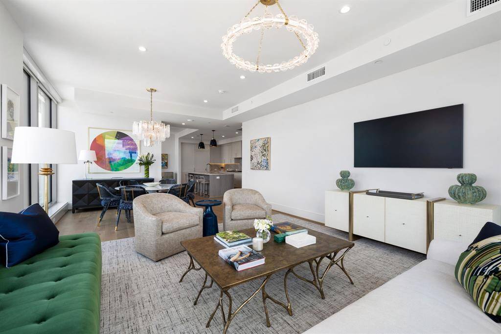 The living area effortlessly flows into the dining space and kitchen.
