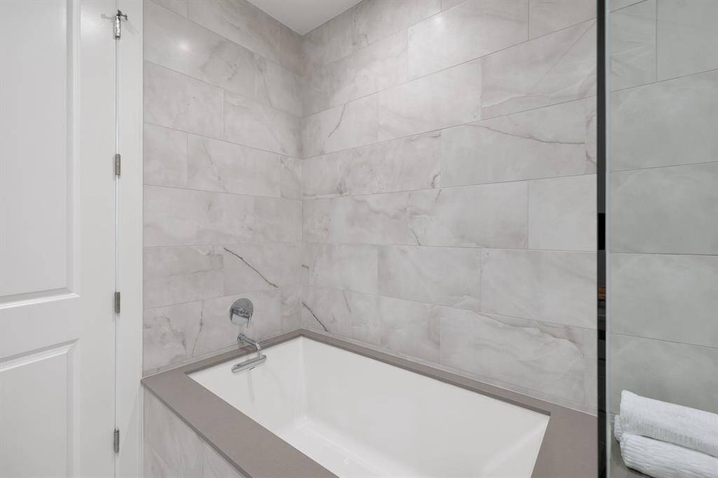 Separate tub in primary bathroom.