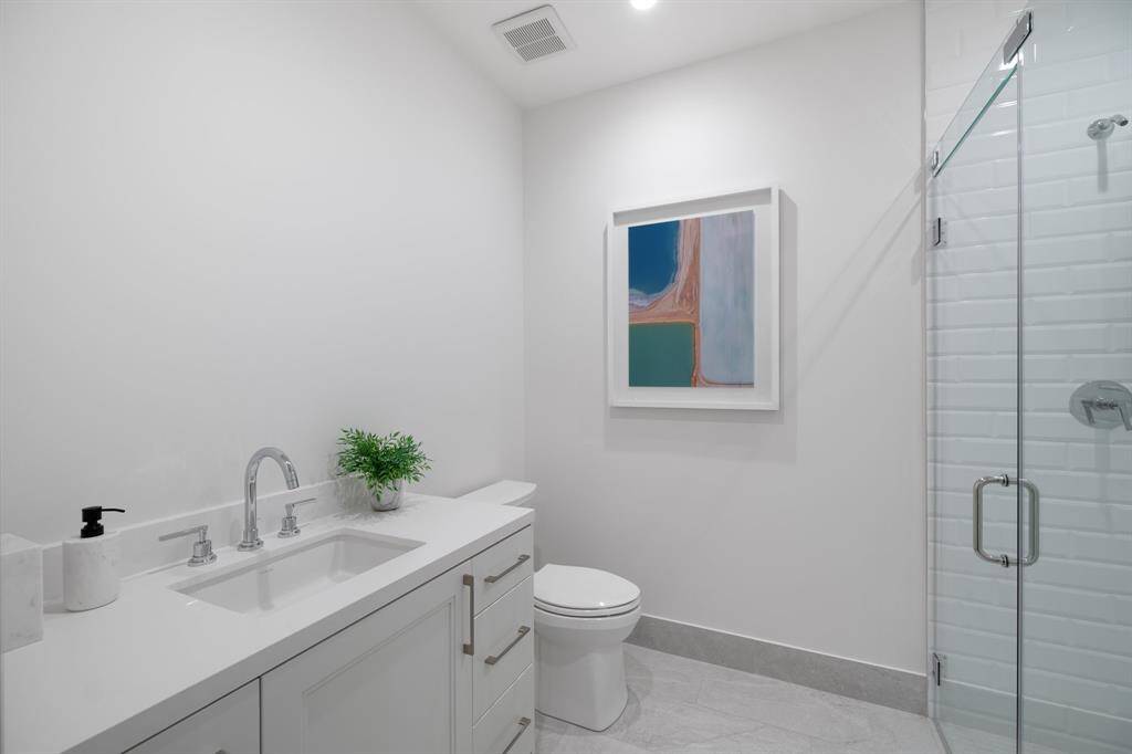 Secondary bathroom with a walk-in shower.