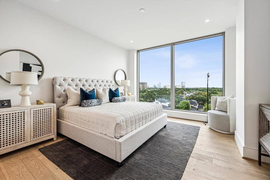 Primary bedroom featuring floor-to-ceiling windows Spectacular Southern views