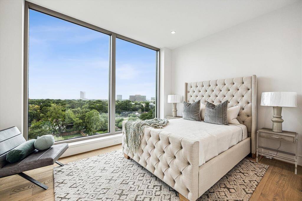 En-suite guest bedroom with floor-to-ceiling windows and stunning Southern views..