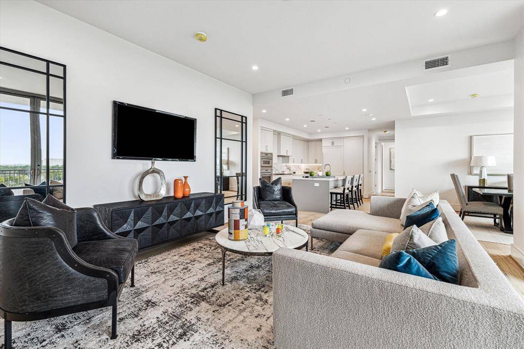 Effortless flow between the living, dining, and kitchen areas in this thoughtfully designed open-concept floor plan.
