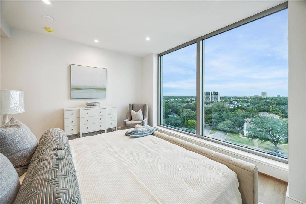Wake up each morning to this spectacular city skyline Northern views in the primary bedroom retreat.