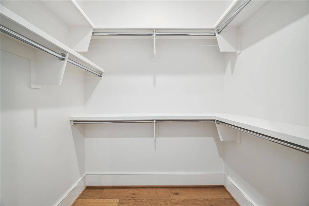 One of the two large walk-in primary closet