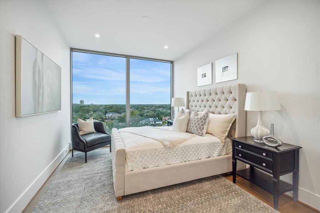 Alternate view of the en-suite guest bedroom with floor-to-ceiling windows and Northern views.