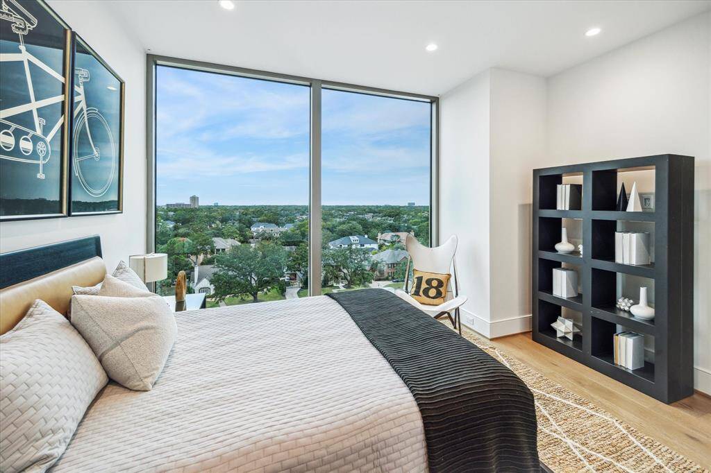 En-suite bedroom featuring floor-to-ceiling windows.